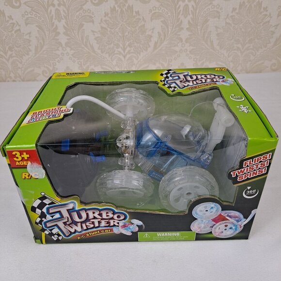 Turbo Twister R/C Stunt Car Blue Clear Flips Twists Spins Ages 3+ NWT - Picture 1 of 9